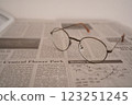 Glasses on the newspaper (right) 123251245