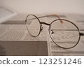Glasses on a newspaper (close-up) 123251246