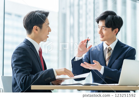 Businessmen working in an office. Filming cooperation: SKY Perfect Tokyo Media Center 123251592