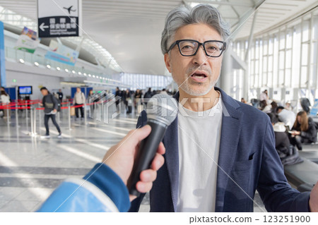 Middle-aged man, airport, travel, interview (property release obtained & facility inspection passed material) Middle-aged man, airport, travel, interview (property release obtained & facility inspection passed material) 123251900