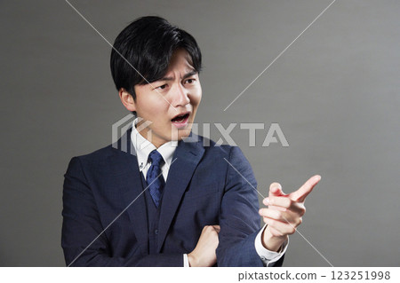 Businessman scolding black background 123251998