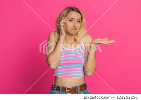 Confused woman feeling embarrassed about question, having doubts, no answer, clueless, uncertain Confused woman feeling embarrassed about question, having doubts, no answer, clueless, uncertain 123252250