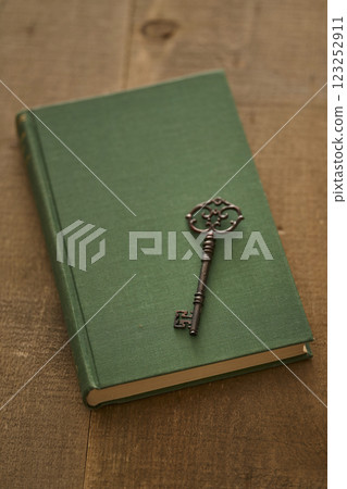 Image of antique book and key Image of antique book and key 123252911