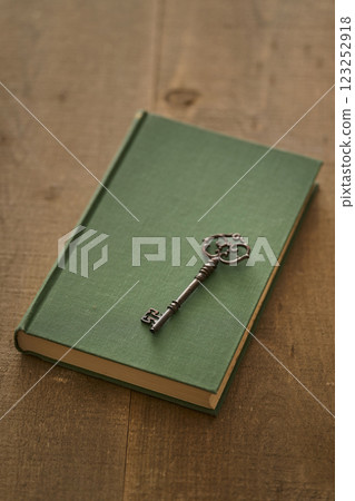 Image of antique book and key Image of antique book and key 123252918