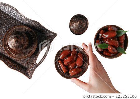 Bronze oriental dishes set, dates and hand, top view, isolated on white background, PNG Bronze oriental dishes set, dates and hand, top view, isolated on white background, PNG 123253106