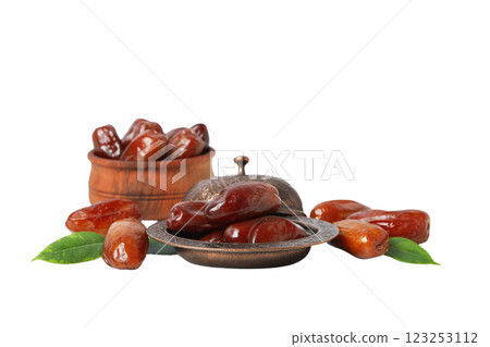 Dried dates in bronze and wooden bowls, close up, isolated on white background, PNG Dried dates in bronze and wooden bowls, close up, isolated on white background, PNG 123253112