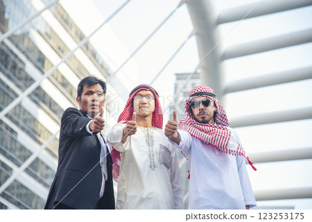 Arab team hold digital tablet uae union teamwork people. Digital marketing arab group of people using smart tablet discuss modern muslim UAE city. Entrepreneur Asian people smile teams meeting. Arab team hold digital tablet uae union teamwork people. Digital marketing arab group of people using smart tablet discuss modern muslim UAE city. Entrepreneur Asian people smile teams meeting. 123253175