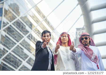 Arab team hold digital tablet uae union teamwork people. Digital marketing arab group of people using smart tablet discuss modern muslim UAE city. Entrepreneur Asian people smile teams meeting. Arab team hold digital tablet uae union teamwork people. Digital marketing arab group of people using smart tablet discuss modern muslim UAE city. Entrepreneur Asian people smile teams meeting. 123253177