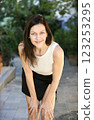 Cheerful brunette posing and looking at the camera on the street of the Old Town in Antalya in Turkey 123253295