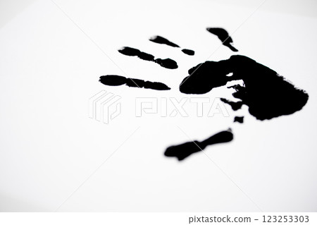Black handprint on white background symbolizing creativity and expression 123253303