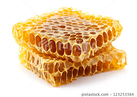 Honeycomb with golden honey beautifully arranged on white background. Flat lay. Top view. Package design element. 123253384