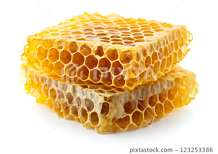 Honeycomb with golden honey beautifully arranged on white background. Flat lay. Top view. Package design element. Honeycomb with golden honey beautifully arranged on white background. Flat lay. Top view. Package design element. 123253386