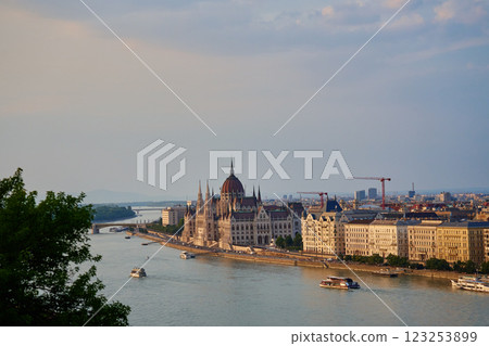 Hungarian Parliament Building in Budapest at sunset with reflection in Danube River. Neo Gothic architecture and famous landmark of Hungary Hungarian Parliament Building in Budapest at sunset with reflection in Danube River. Neo Gothic architecture and famous landmark of Hungary 123253899
