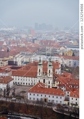Graz cityscape on foggy day. Panoramic view of Graz, Austria with historical architecture. Streets with red roofed buildings in European city 123254008