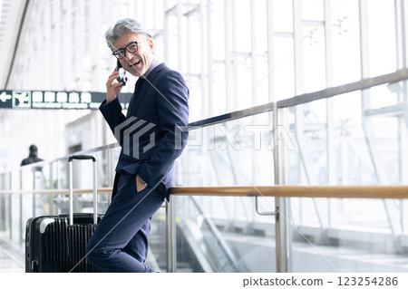 Middle-aged man, airport, business trip (property release obtained & facility inspection passed material) 123254286