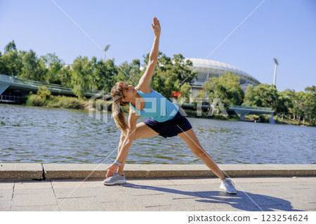 Woman doing yoga or stretching 123254624