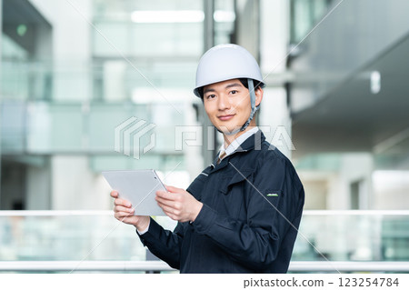 Male worker working in an office building. Filming cooperation: SKY Perfect Tokyo Media Center 123254784