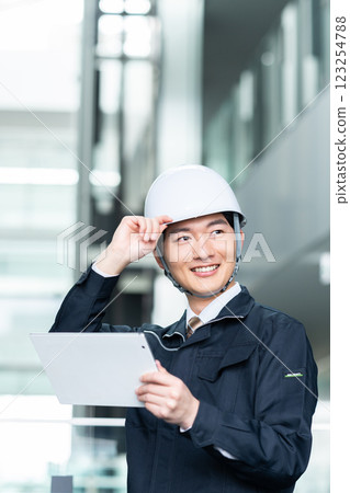 Male worker working in an office building. Filming cooperation: SKY Perfect Tokyo Media Center 123254788