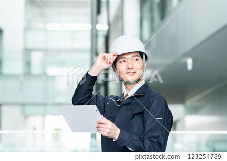 Male worker working in an office building. Filming cooperation: SKY Perfect Tokyo Media Center 123254789