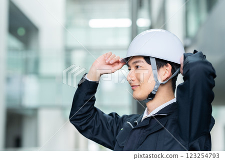 Male worker working in an office building. Filming cooperation: SKY Perfect Tokyo Media Center 123254793