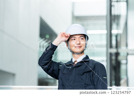 Male worker working in an office building. Filming cooperation: SKY Perfect Tokyo Media Center 123254797