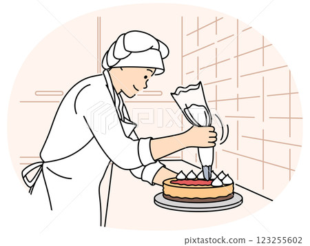 Female chef decorating cake at restaurant 123255602
