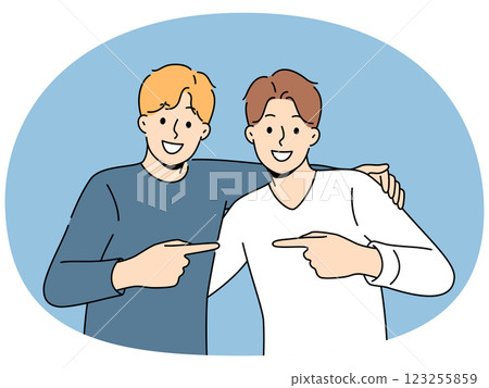 Two men friends hug and point finger towards buddy, rejoicing at long-awaited meeting Two men friends hug and point finger towards buddy, rejoicing at long-awaited meeting 123255859