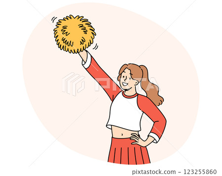 Young woman cheerleader raises hand with pumpon up supporting college soccer team 123255860