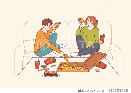 Problem gluttony guy and woman eating fast food, sitting on couch at table with burgers and pizza 123255928