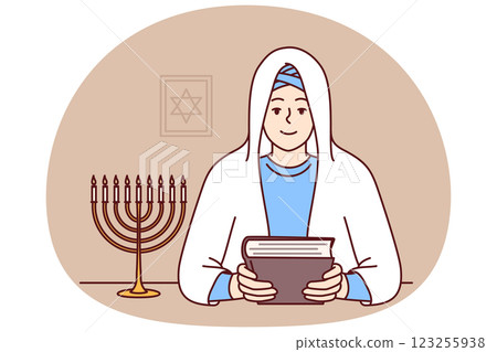 Jewish woman rabbi in white veil, holds torah in hands and sits near image of star of david Jewish woman rabbi in white veil, holds torah in hands and sits near image of star of david 123255938