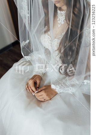 A tender bride strokes her body with her hands and sensually touches her skin. Sensual moment A tender bride strokes her body with her hands and sensually touches her skin. Sensual moment 123256225