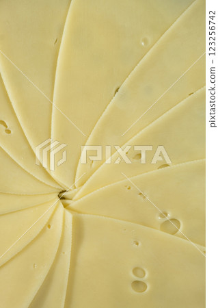 Semi-hard cheese close-up, thin slices, top view Semi-hard cheese close-up, thin slices, top view 123256742