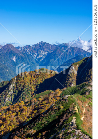 Autumn foliage of Mt. Harinoki seen from Kisaku Shindo. Climbing Mt. Yari on the Northern Alps Omote Ginza traverse. Autumn foliage of Mt. Harinoki seen from Kisaku Shindo. Climbing Mt. Yari on the Northern Alps Omote Ginza traverse. 123256919