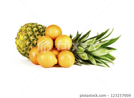 Several tropical fruits lie in a group on a white background Several tropical fruits lie in a group on a white background 123257009