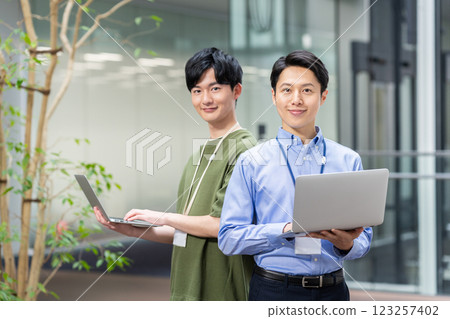 Engineers working in the office. Photo courtesy of Sky Perfect Tokyo Media Center. 123257402