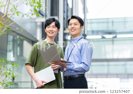 Engineers working in the office. Photo courtesy of Sky Perfect Tokyo Media Center. 123257407