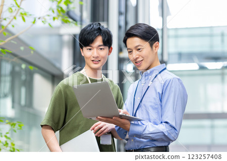 Engineers working in the office. Photo courtesy of Sky Perfect Tokyo Media Center. 123257408