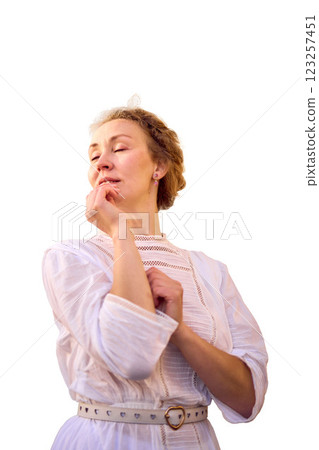 elegant middle age woman in white vintage dress near theater with antique colonnades elegant middle age woman in white vintage dress near theater with antique colonnades 123257451