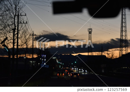 On the way home from a trip: Many car headlights at dusk 123257569