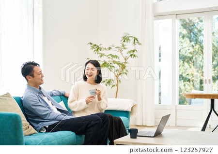 A couple relaxing on the sofa A couple relaxing on the sofa 123257927