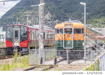 169 series train and SR1 series train at Sakaki Station on the Shinano Railway Line 123258142