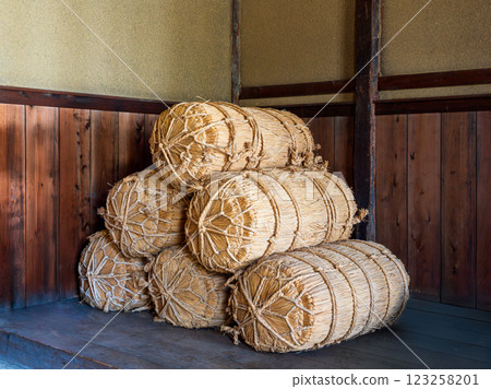 Rice bales stacked at an old house Rice bales stacked at an old house 123258201