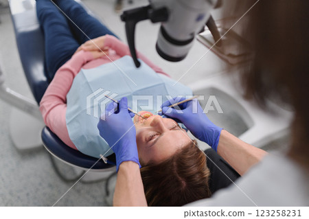 A woman has a dental check-up in dentist surgery. 123258231