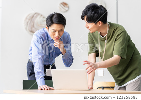 Engineers working in the office. Photo courtesy of Sky Perfect Tokyo Media Center. 123258585