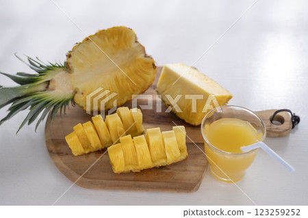 Cut pineapple and pineapple juice 123259252