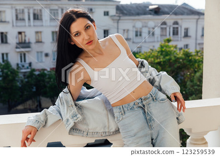 Portrait of Beautiful Slim Fashionable Brunette Woman in Jeans Portrait of Beautiful Slim Fashionable Brunette Woman in Jeans 123259539