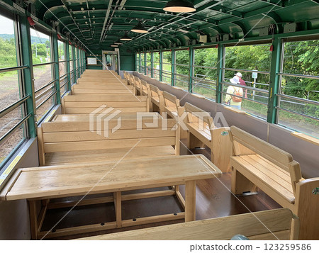 Inside the Kushiro Marsh Norokko train: Wooden tables and chairs, Senmo Main Line, tourist train Inside the Kushiro Marsh Norokko train: Wooden tables and chairs, Senmo Main Line, tourist train 123259586