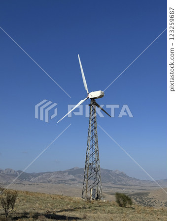 Wind turbines and green mountain nature landscape near the sea. Green energy concept. aerial view. Wind turbines and green mountain nature landscape near the sea. Green energy concept. aerial view. 123259687
