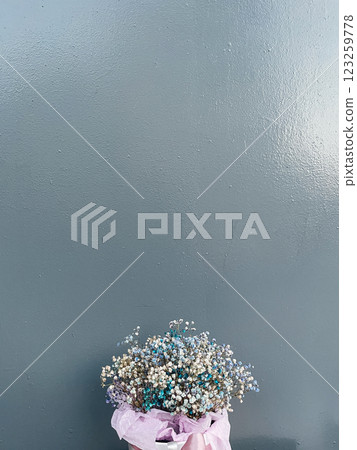 Basket of Flowers on a Gray Background Basket of Flowers on a Gray Background 123259778