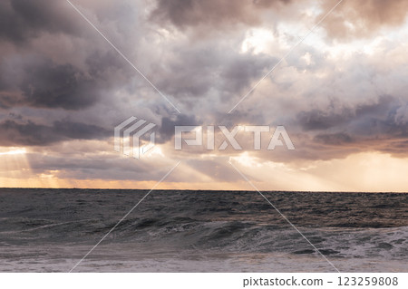 Beautiful landscape stormy sea and sky at sunset with clouds Beautiful landscape stormy sea and sky at sunset with clouds 123259808